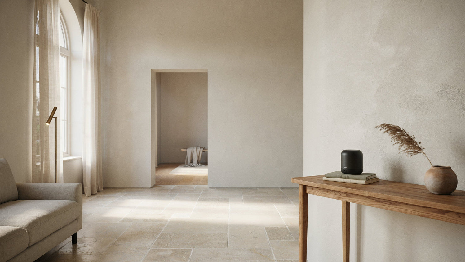 Waterless scent diffuser placed on a high console in a calm, open living room.