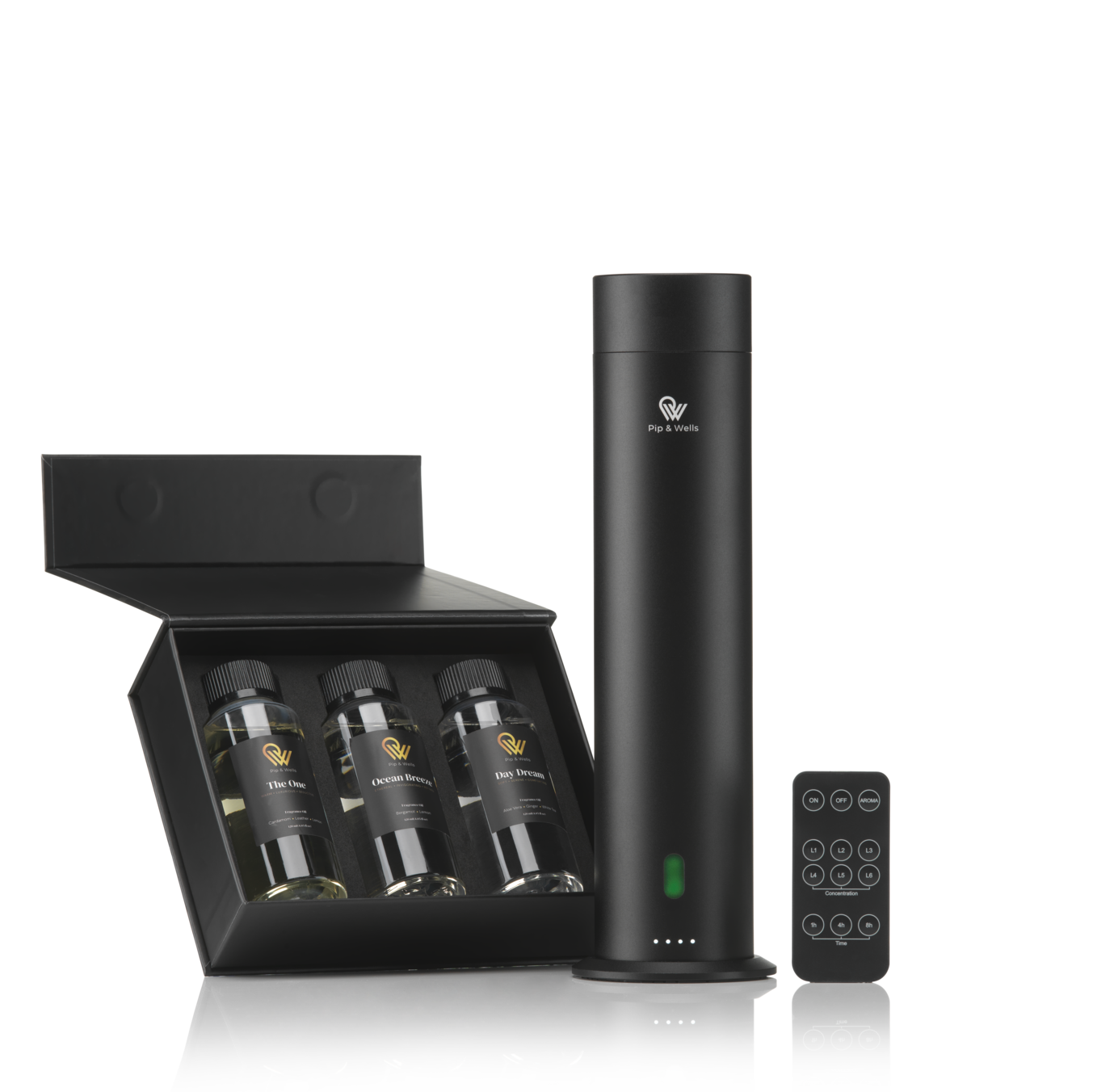 Black diffuser with remote control and three wine bottles in a box on a white background