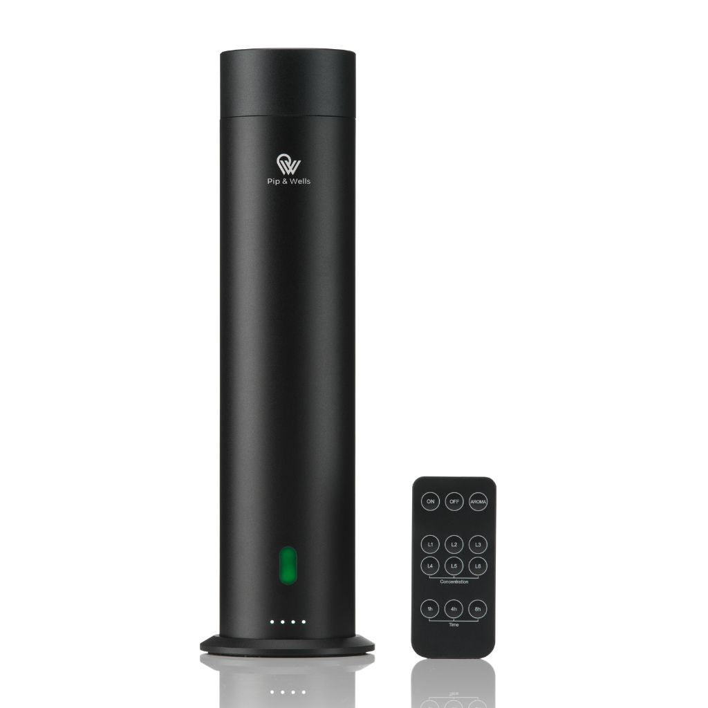 Matte-black Pure One aroma diffuser with three fragrance oils