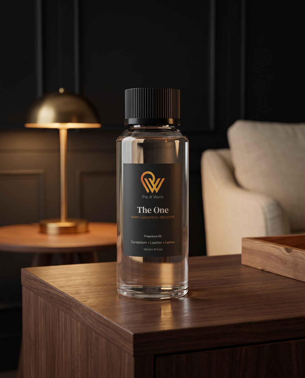 Pip & Wells The One fragrance oil 120 ml bottle on a walnut console in a hotel-style lounge